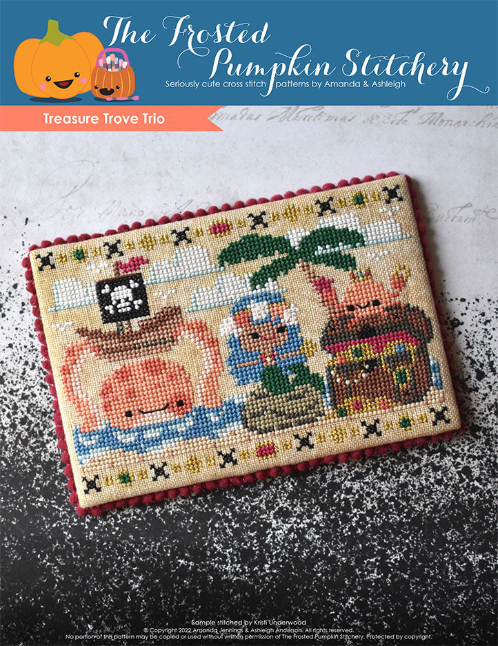 Treasure Trove Trio Cross Stitch Pattern Cover. Cover features a mermaid sitting on a rock at the beach holding a gold coin. Next to her is a crab sitting on top of a treasure  chest wearing a crown and holding treasure in his claws. Behind them, a giant octopus is holding a pirate ship above its head. 