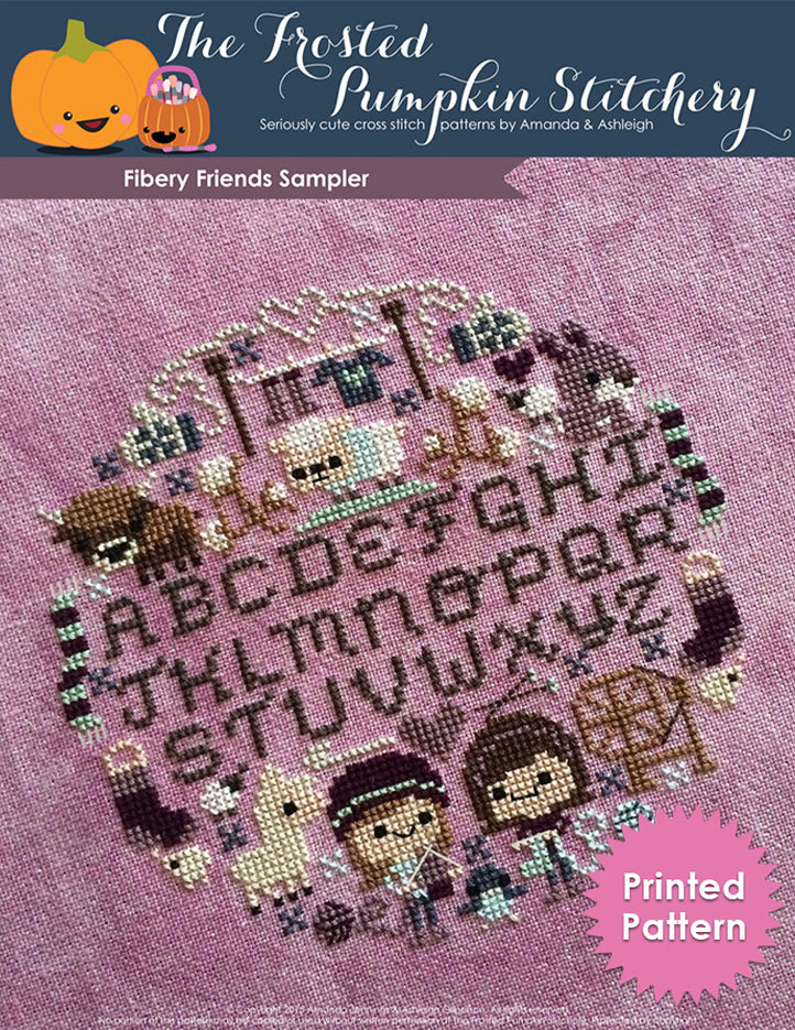 Fiber-y friends counted cross stitch pattern. Traditional alphabet sampler surrounded by two friends knitting, sheep, wool, scarves, alpaca, bunnies and a yak. Printed Pattern.