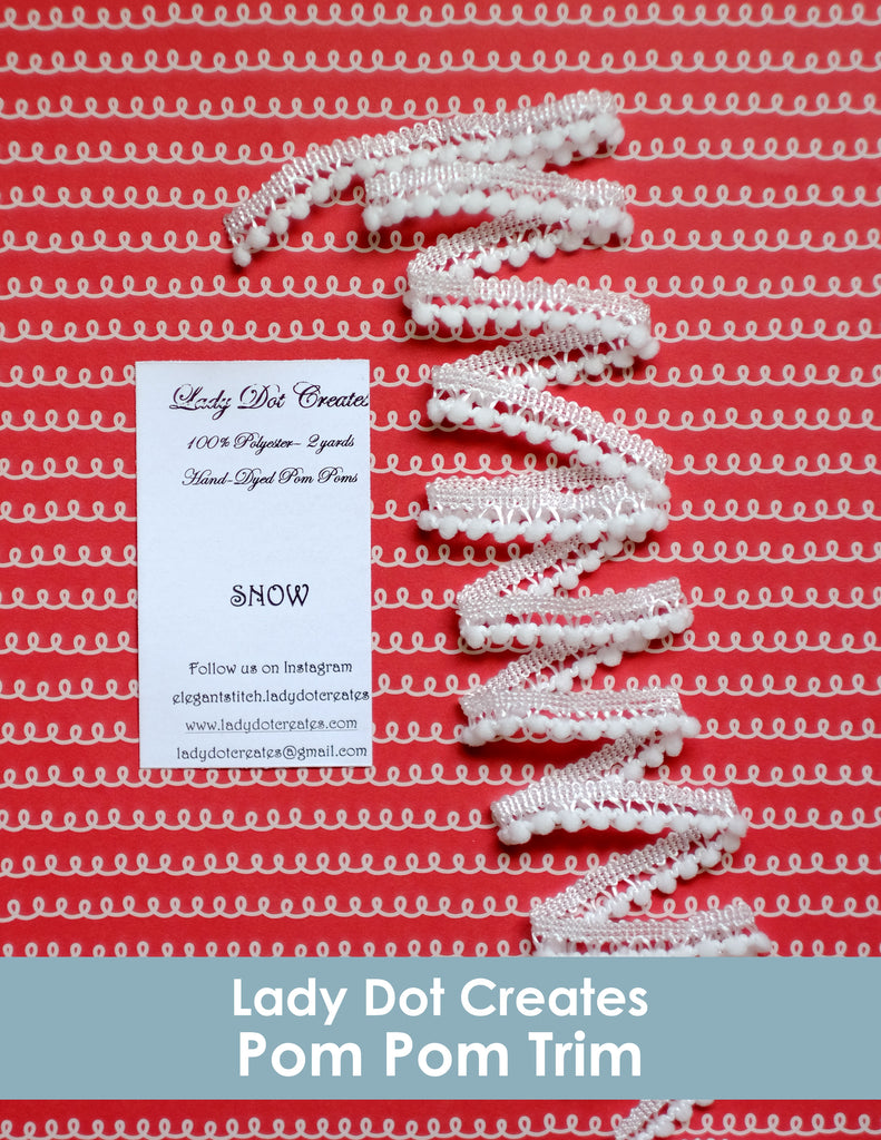 pom pom trim from lady dot creates in snow