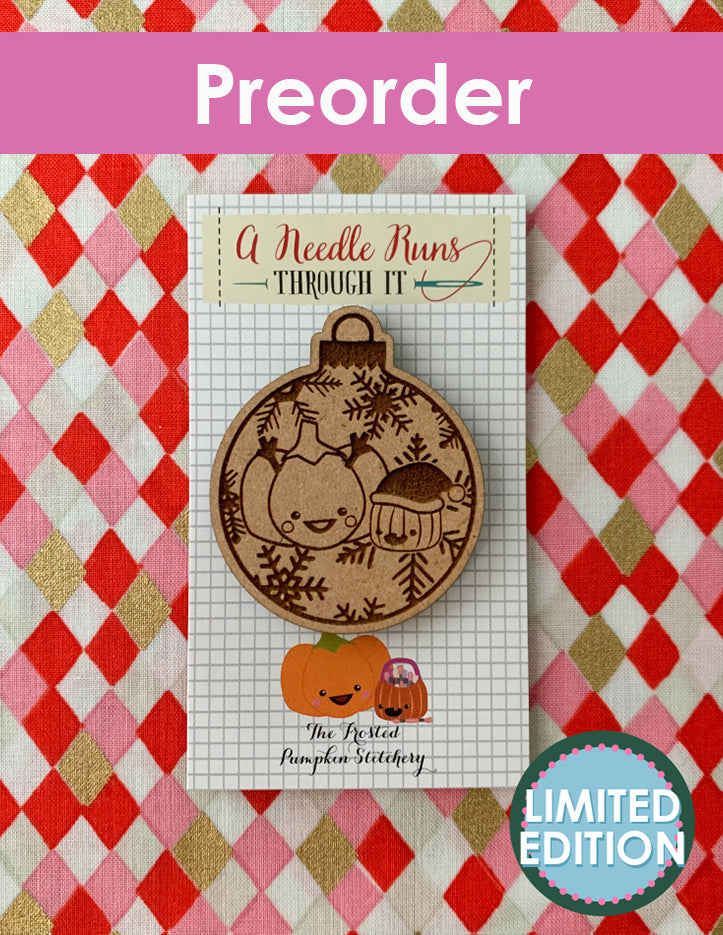 Wooden ornament with pumpkin design on a checkered background with preorder text.