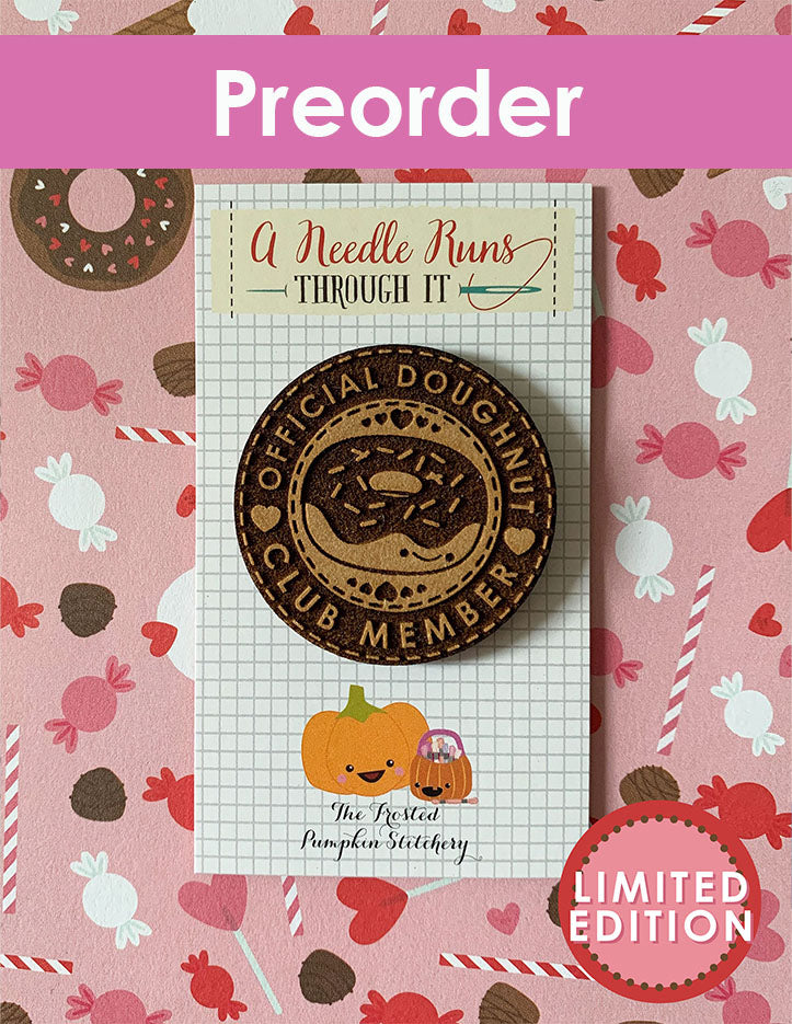 Needleminder a doughnut-themed design on a pink background with candy patterns.