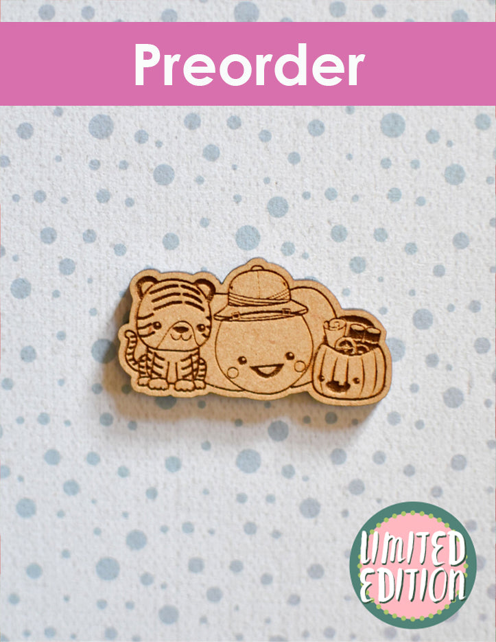 Wooden needleminder with a tiger and two pumpkins ready for a safari on a polka dot background, preorder text at the top.