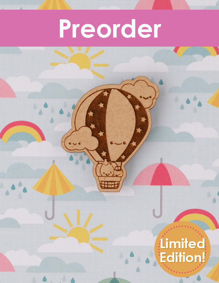 Preorder for a hot air balloon with Sugarloaf and Jack inside wooden needleminder on a colorful background.