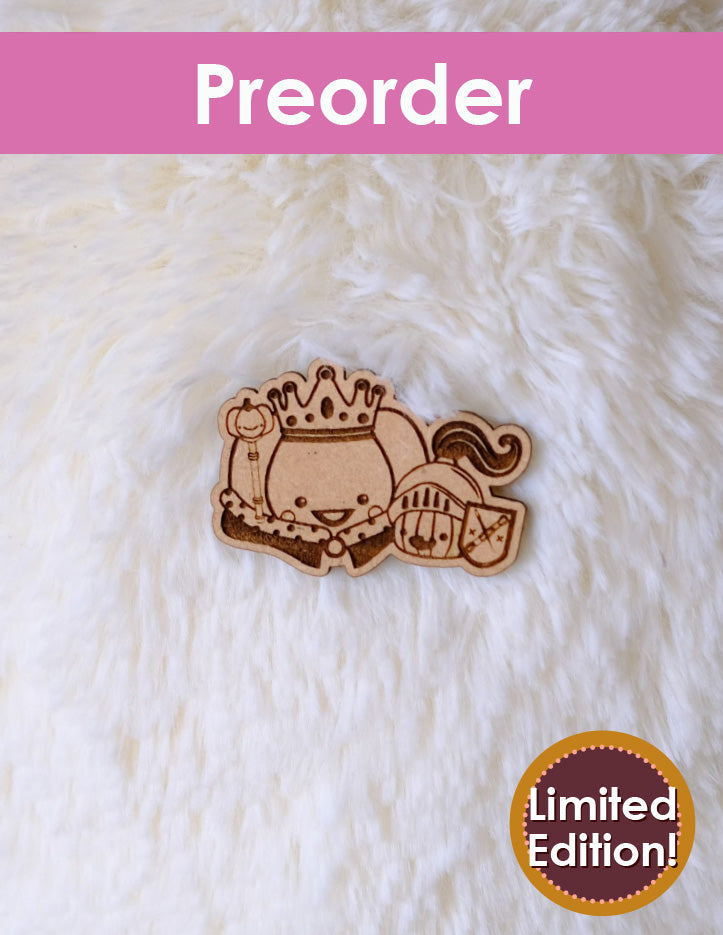Wooden needleminder with a crown design on a white fluffy background, labeled 'Preorder Limited Edition'.
