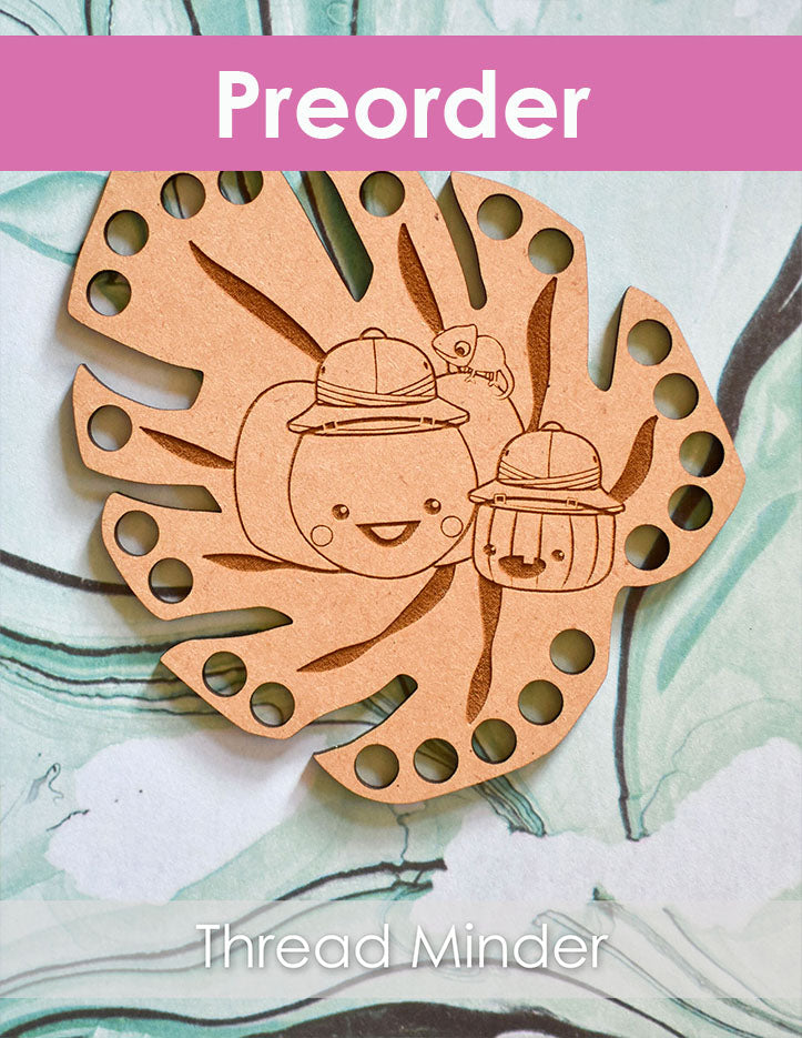 Wooden thread minder with Sugarloaf and Jack on a marble background, labeled 'Preorder' and 'Thread Minder'.