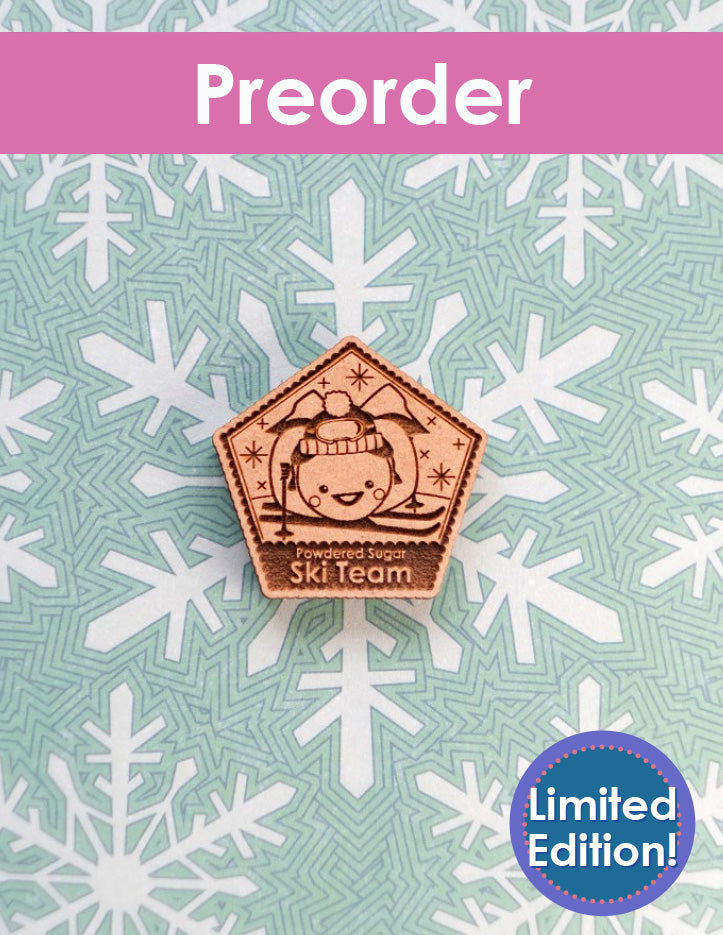 Needleminder with a Sugarloaf pumpkin design on a snowflake pattern background, labeled 'Preorder Limited Edition'.