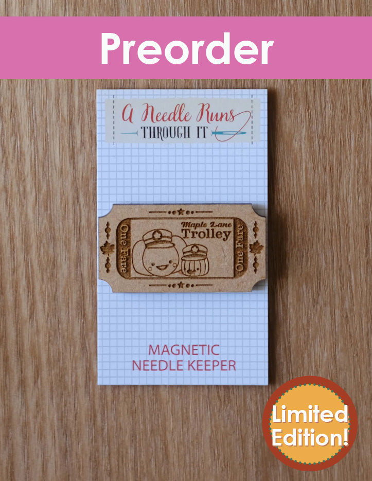 Magnetic needle keeper with a trolley design on a wooden surface, labeled 'Preorder' and 'Limited Edition'.