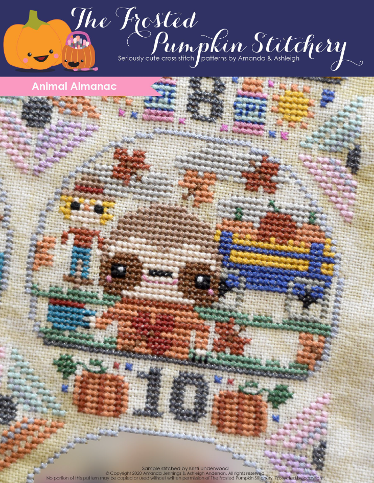 Animal Almanac Cross Stitch Pattern Cover. Image of sloth wearing an autumn sweater and drinking a coffee while spending time at the local pumpkin patch. A scarecrow, wagon full of hay and autumn leaves are in the background.