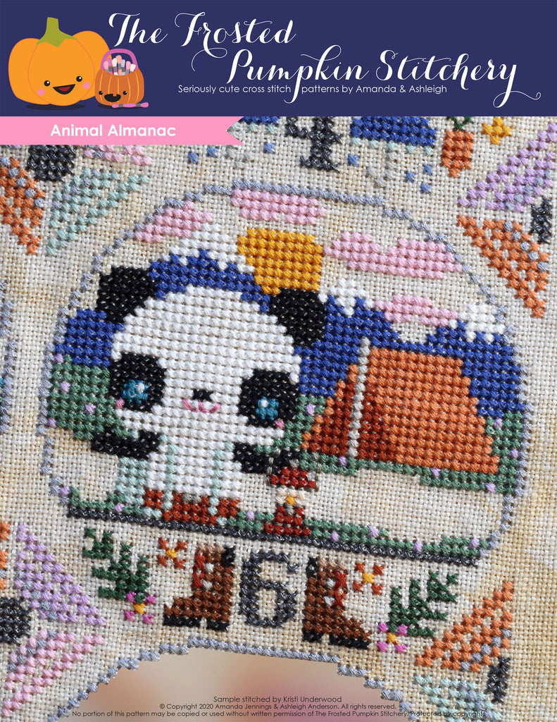Animal Almanac Cross Stitch Pattern Cover. Image of a panda bear wearing suspenders and pants. He's holding a camping lantern and is in the mountains with a tent.