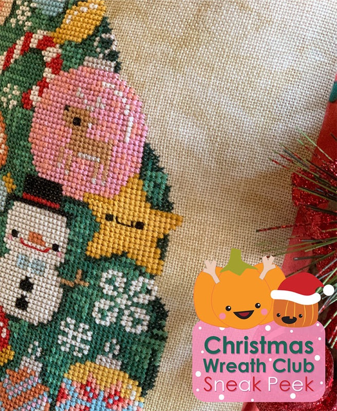 Christmas Wreath Club Sneak Peek number two. Top right corner of the pillow with ornaments, a snowman, snow flakes and a chubby star.