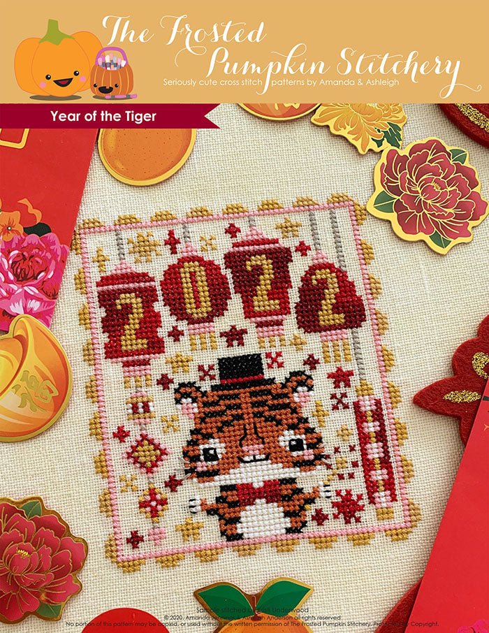 Year of the Tiger counted cross stitch pattern. A tiger wearing a top hat and sparkler with lanterns that say 2022.