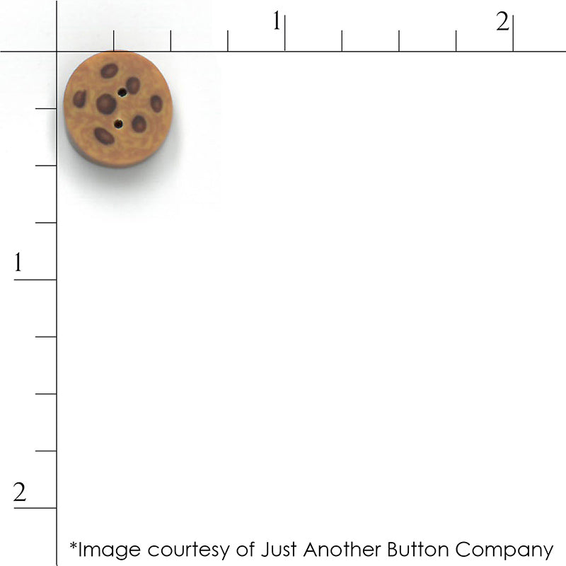 Just Another Button Company chocolate chip cookie button with a ruler for scale.
