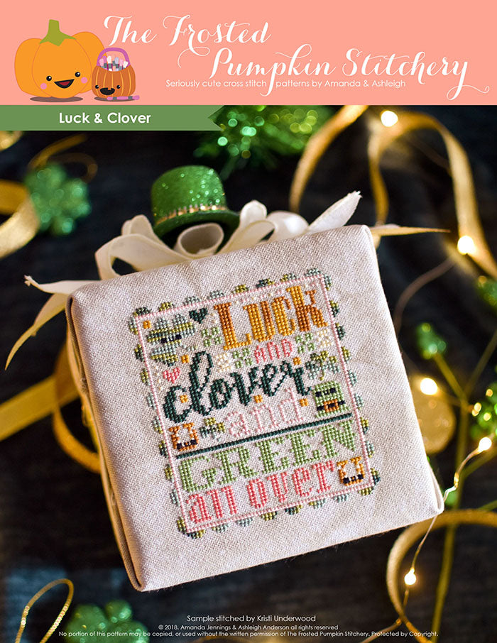 Luck and Clover counted cross stitch pattern. St. Patrick's Day inspired with pinks, golds, dark and light green. Text reads "Luck and Clover and Green All Over".