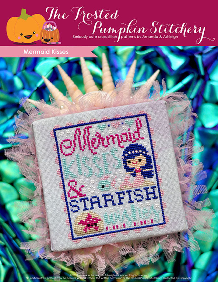 Mermaid kisses counted cross stitch pattern. Text reads "Mermaid kisses and starfish wishes". A white skinned blue haired mermaid swims under the sea with a starfish.
