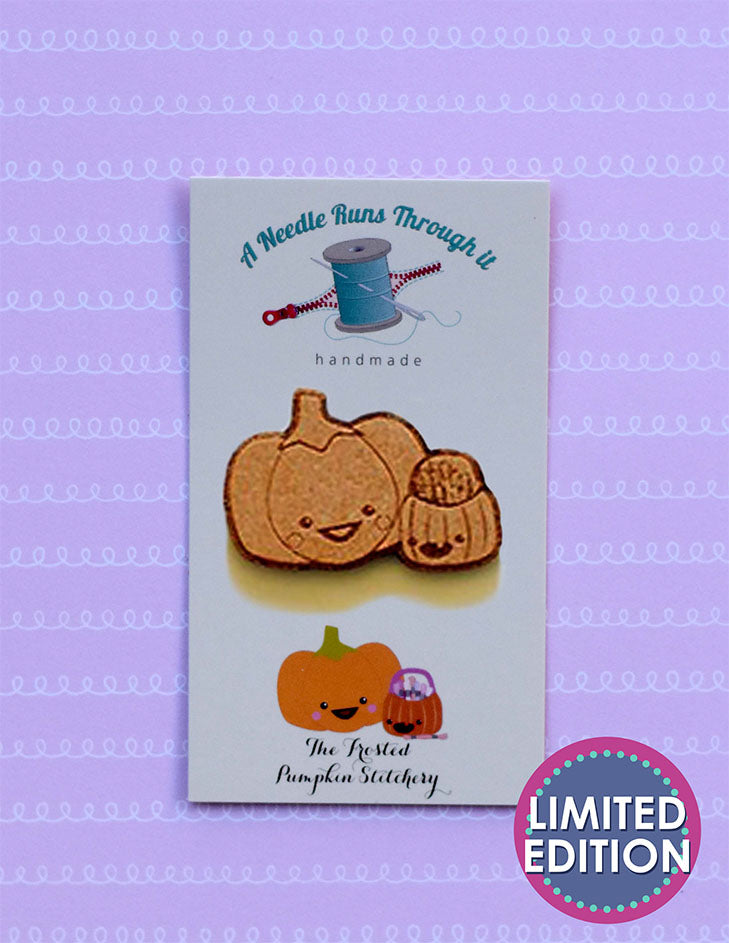 Image of a wooden needleminder with Sugarloaf and Jack (TFPS mascots who are pumpkins.)
