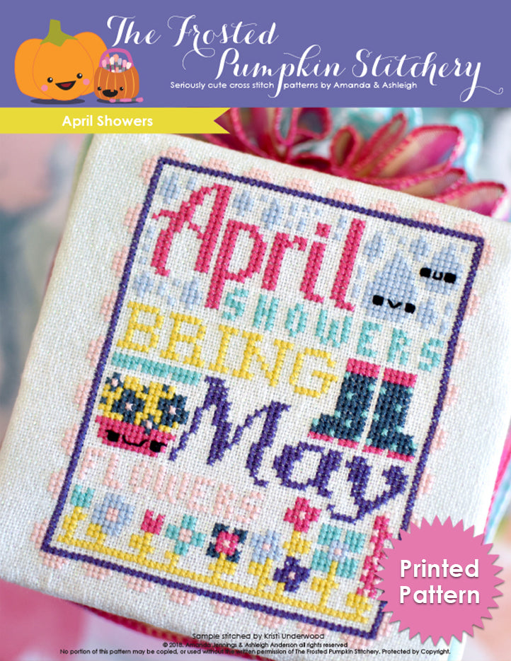 Cross stitch pattern with text reading "April Showers Bring May Flowers" in bright colorful jewel tones.