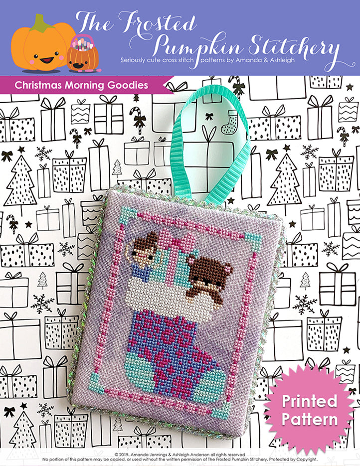 Christmas Morning Goodies counted cross stitch pattern. A ballerina doll, an aqua paper wrapped gift and a teddy bear peek out of a fair isle printed stocking. Text reads "Printed Pattern."