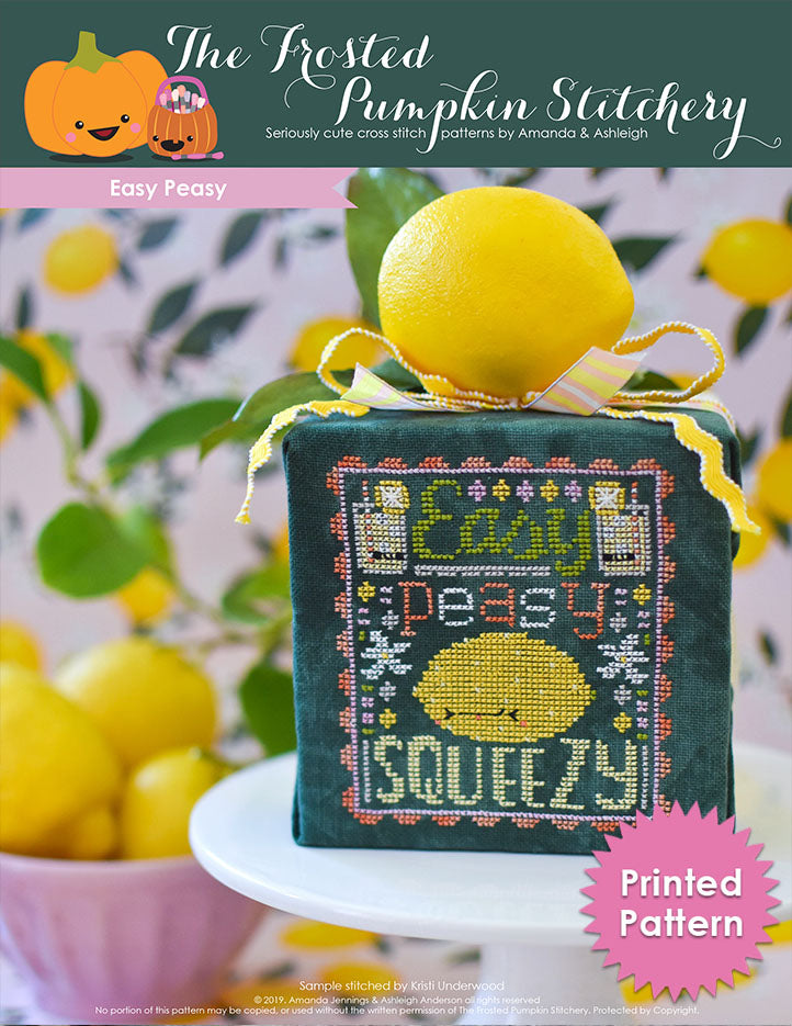 Easy Peasy Counted Cross Stitch Pattern. Image of a sour faced lemon stitched on green fabric with the text Easy Peasy above the lemon and below the word Squeezy. Text reads "Printed Pattern."
