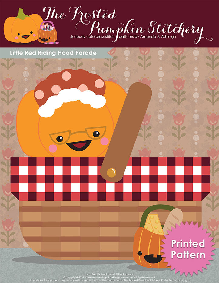 Little Red Riding Hood Parade printed pattern cover features Sugarloaf the Pumpkin sitting in a picnic basket dressed as grandma and Jack the Pumpkin has his candy bucket filled with cheese and loaves of bread.