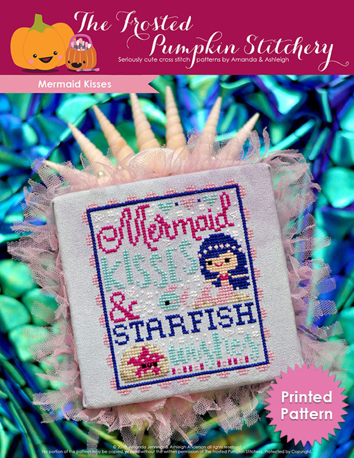 Mermaid kisses counted cross stitch pattern. Text reads "Mermaid kisses and starfish wishes". A white skinned blue haired mermaid swims under the sea with a starfish. Printed Pattern.