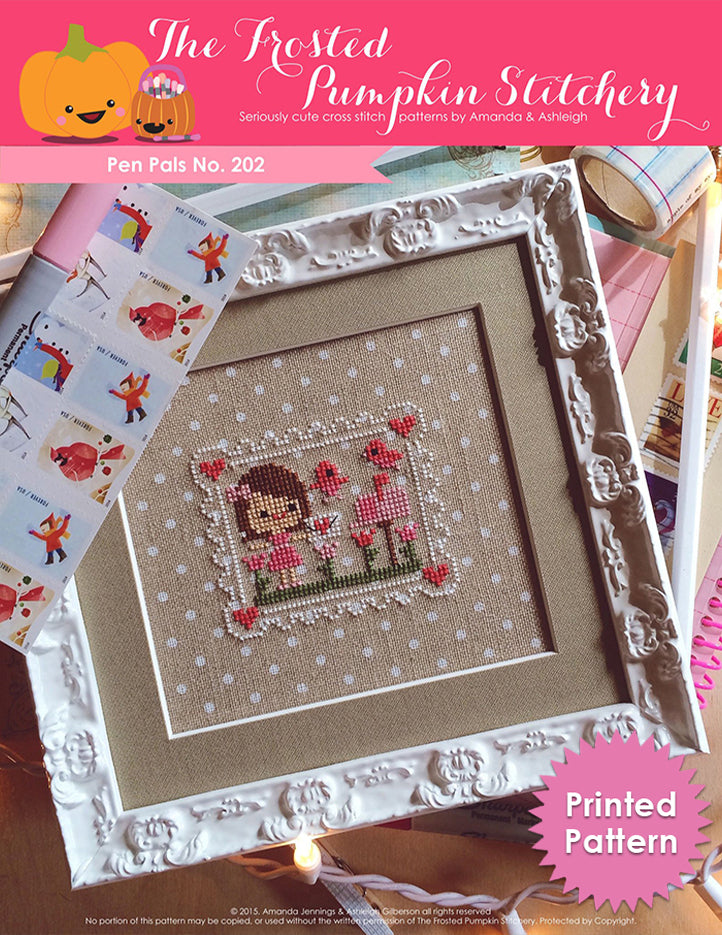 Pen Pals No 202 Counted Cross Stitch Pattern. A white girl with brown hair gets an envelope from a mailbox. Stitched on polka dot fabric in a white frame. Printed Pattern.