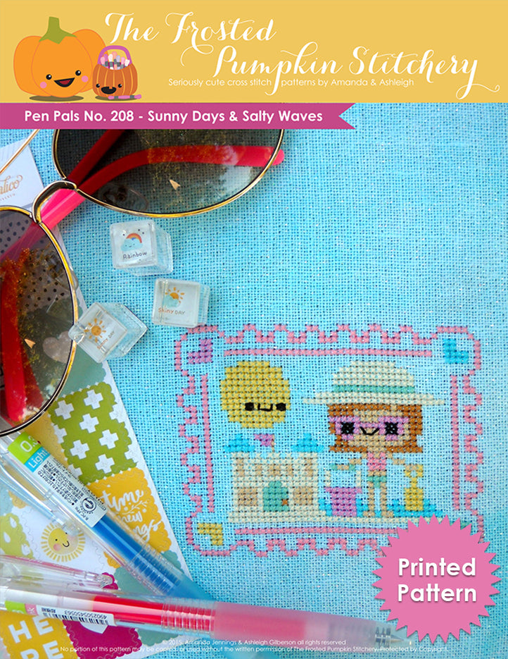 Pen Pals No 208 Sunny Days and Salty Waves counted cross stitch pattern. A girl with pale skin, pink sunglasses and a sun hat is building a sandcastle. Printed Pattern.