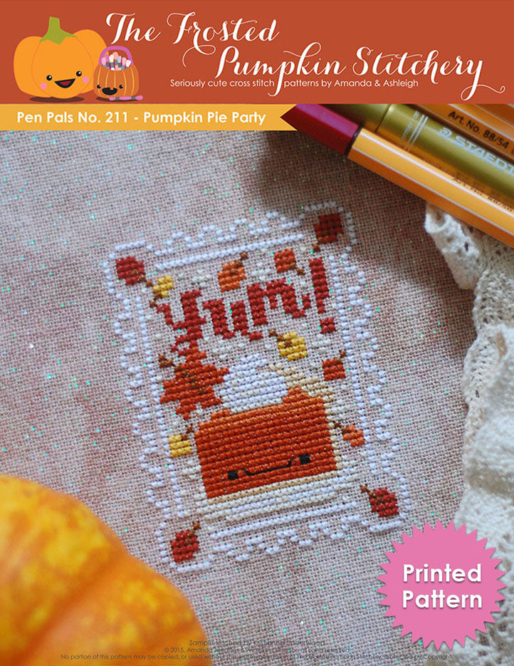 Pen Pals No 211 Pumpkin Pie Party counted cross stitch pattern. A kawaii slice of pumpkin pie on a plate. Surrounded by falling leaves and the word "Yum". Printed Pattern.
