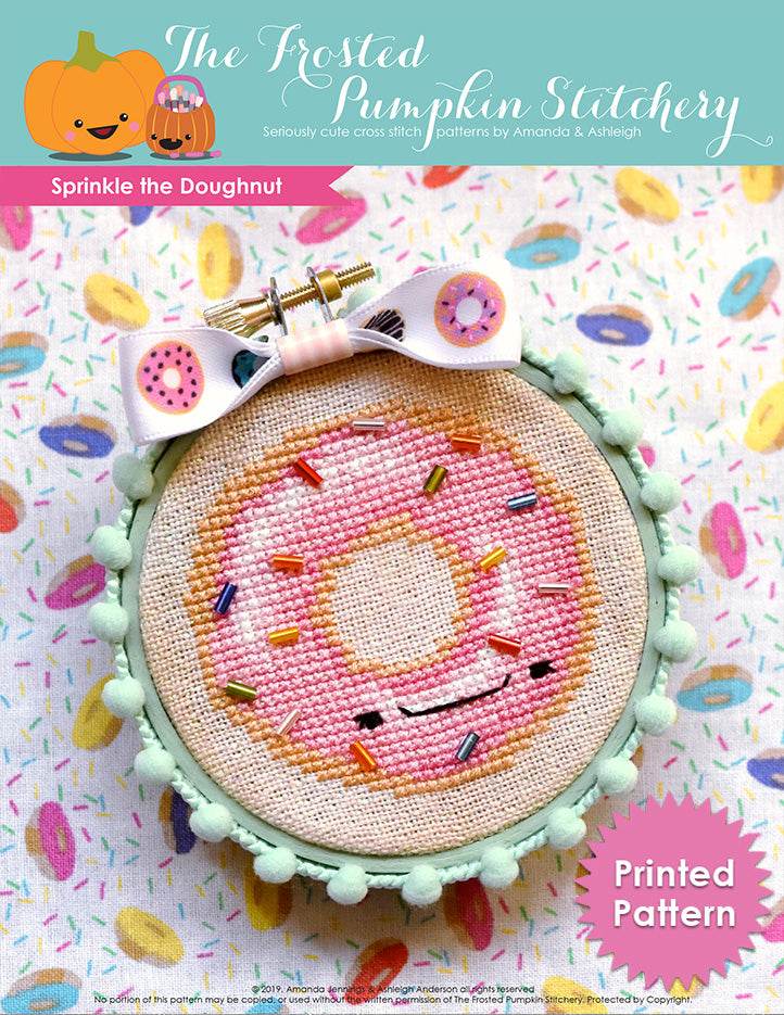 Sprinkle the Doughnut counted cross stitch pattern. Sprinkle is a doughnut with pink frosting and bead sprinkles. He's finished in a mint green embroidery hoop. Printed Pattern.