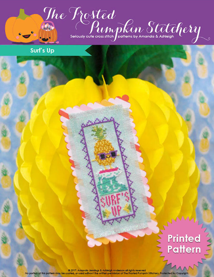 Surf's Up counted cross stitch pattern. A surfing pineapple on a bookmark. Text reads "Surf's Up". Printed Pattern.