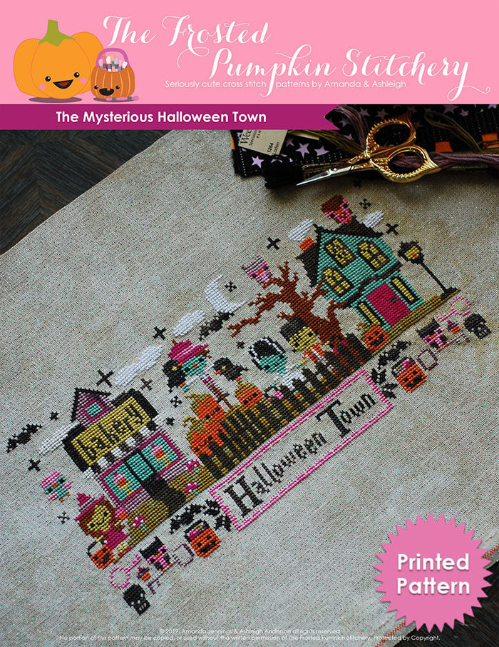 Mysterious Halloween Town counted cross stitch pattern. Bottom text says Halloween Town. The town has a witch in front of a bakery, a scarecrow among pumpkins, Frankenstein and his Bride next to a haunted house. Printed Pattern.
