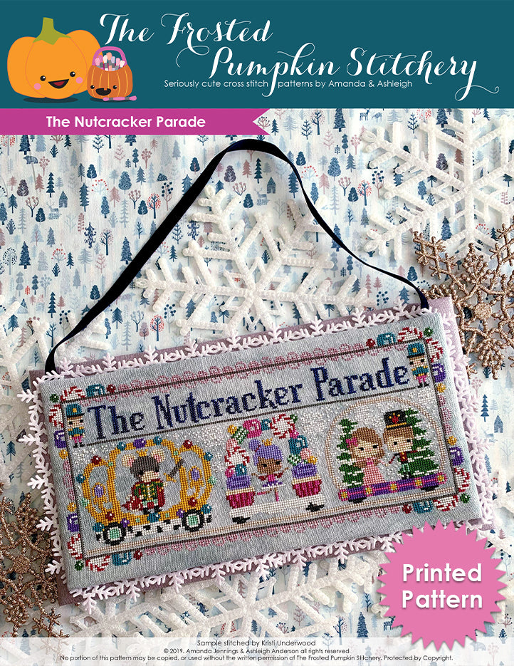 The Nutcracker Parade counted cross stitch pattern. The sugarplum fairy is in a candy decorated float, the rat king is in a crown decorated float to her left and Clara and the prince are in the float to the right. Printed Pattern.