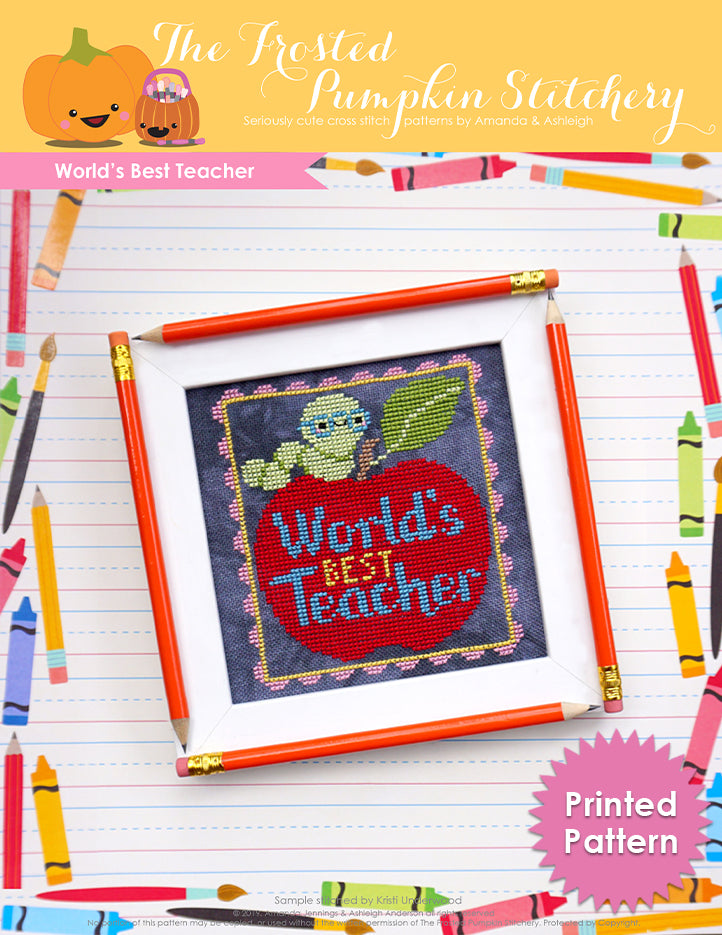 World's Best Teacher counted cross stitch pattern. An apple with the text reading "World's Best Teacher" with a worm wearing glasses on top. Printed Pattern.