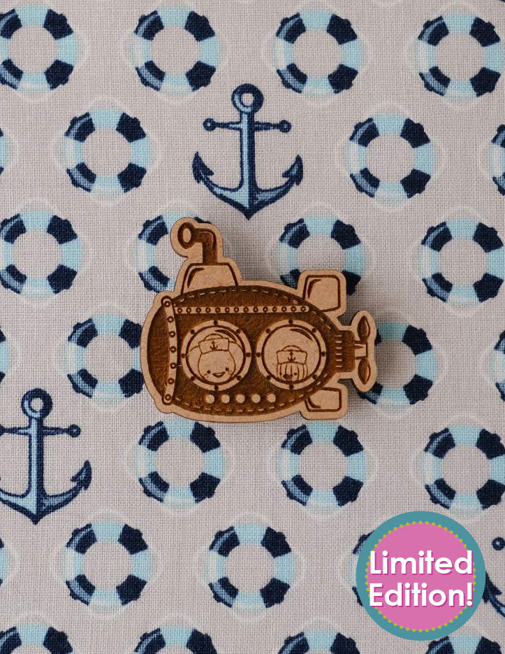 SS Backstitch Needleminder. A wooden needleminder featuring Sugarloaf and Jack in a submarine.