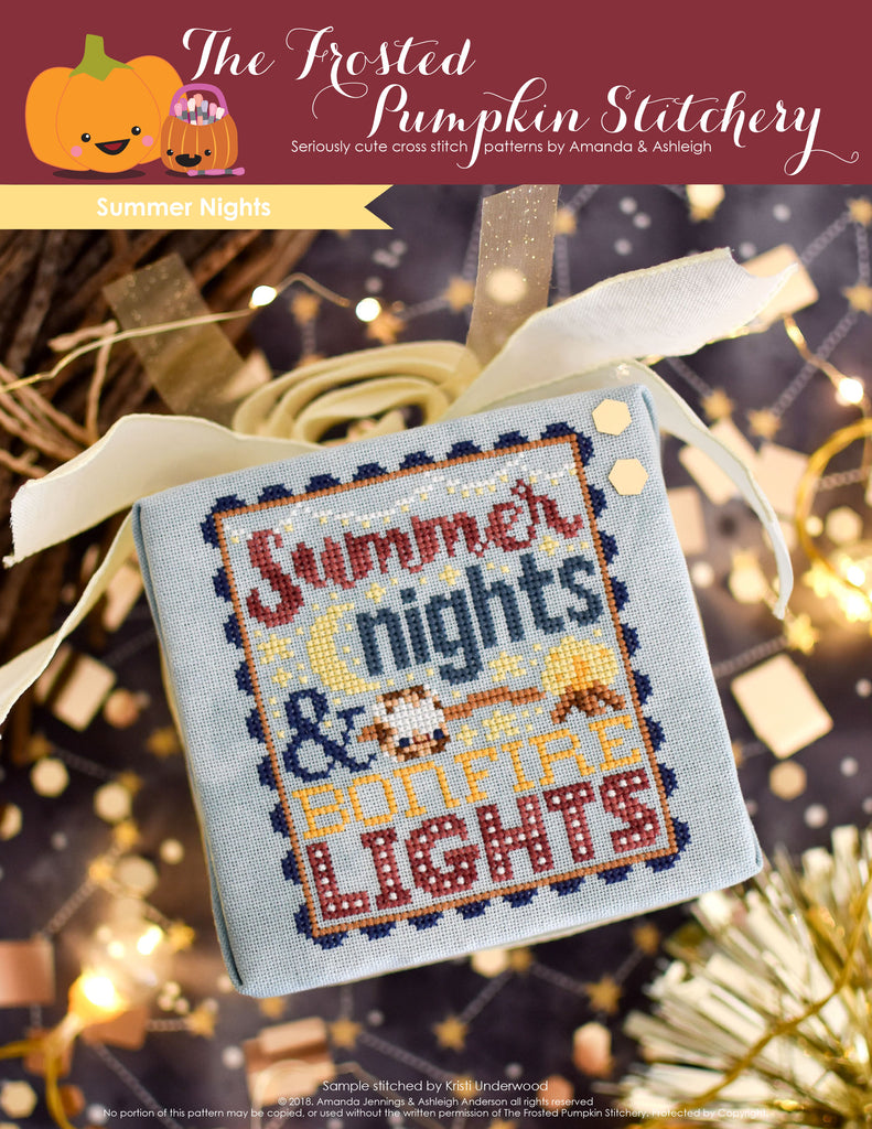 Summer Nights Counted Cross Stitch Pattern. Image of a cross stitch pattern with text that says "summer nights and bonfire lights". There is a marshmallow on a stick and a bonfire in the pattern.