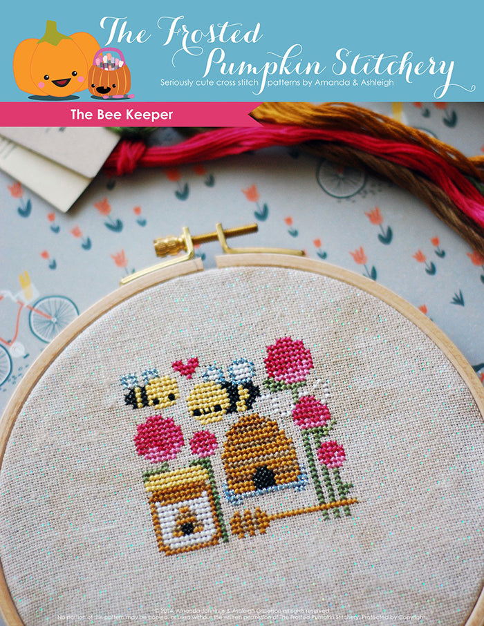 The Bee Keeper counted cross stitch pattern. Two bees with a hive, honey and thistles.