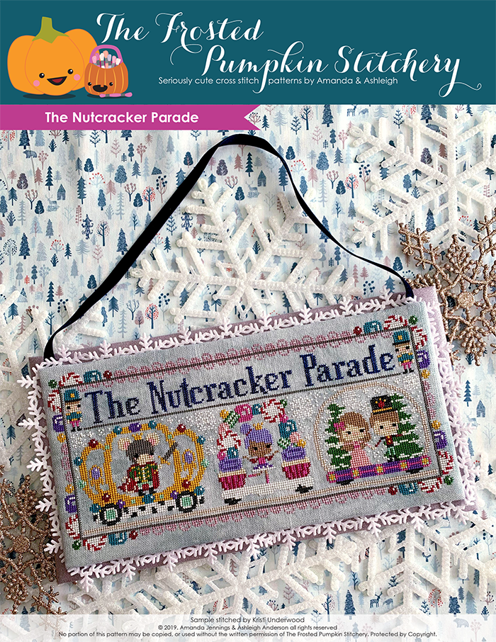 The Nutcracker Parade counted cross stitch pattern. The sugarplum fairy is in a candy decorated float, the rat king is in a crown decorated float to her left and Clara and the prince are in the float to the right.