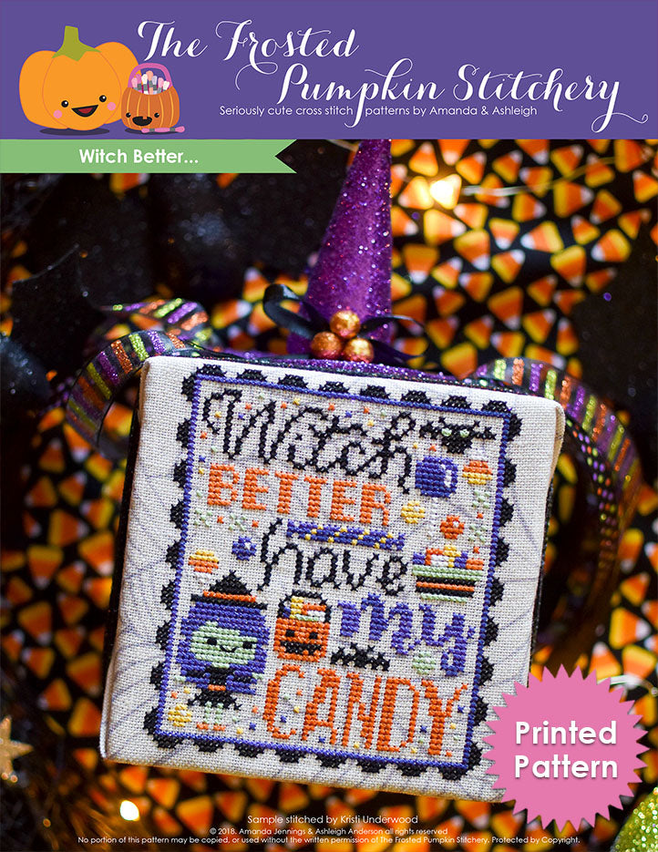 Witch Better Halloween Counted Cross Stitch Pattern. Image of a green skinned witch wearing a hat, stitched on cobweb printed fabric, surrounded by candy. The text reads "Witch better have my candy". Background of the photo is candy corn fabric. Printed Pattern.